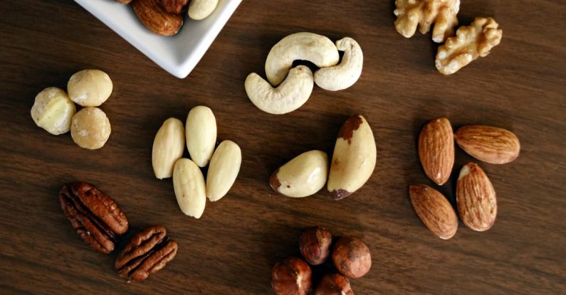 NFTs - Variety of Brown Nuts on Brown Wooden Panel High-angle Photo