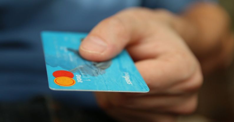 Transfer - Person Holding Debit Card