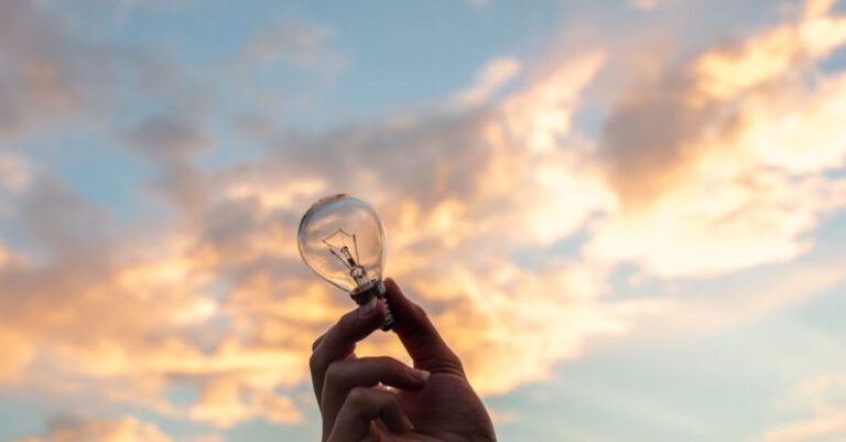 Innovate - Person Holding Clear Light Bulb