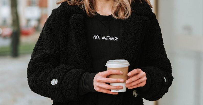 Averaging - Crop smiling woman with coffee to go on city street