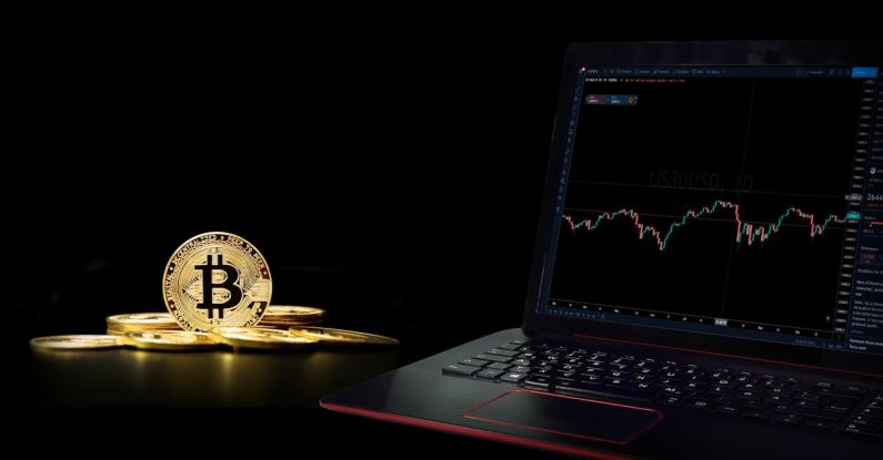 Decentralization - A Laptop Displaying a Graph beside a Commemorative Coin