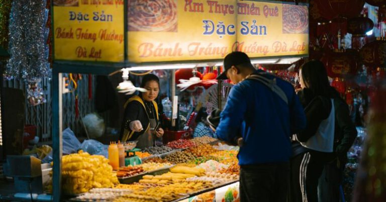 Marketplaces - A man standing in front of a food stand